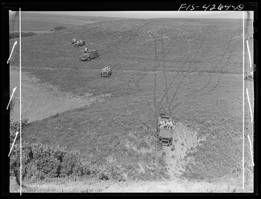 Fort Riley, Kansas. Jeeps going down a steep grade during a training demonstration