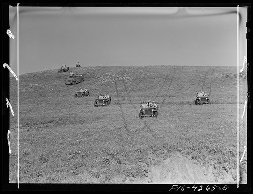 Fort Riley, Kansas. Jeeps going down a steep grade during a training demonstration