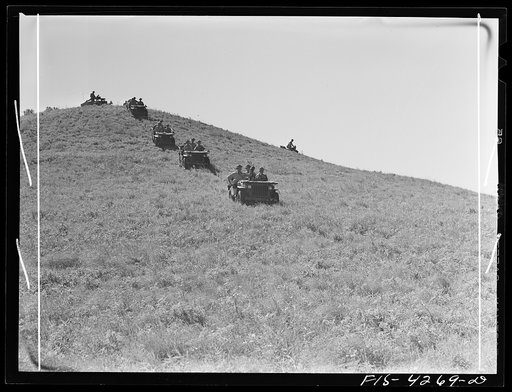 Fort Riley, Kansas. Jeeps going down a steep grade during a training demonstration