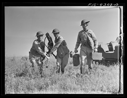 Fort Riley, Kansas. A machine gun unit setting up their gun during a sham battle
