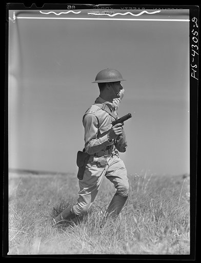 Fort Riley, Kansas. A lieutenant leading an attack during a sham battle