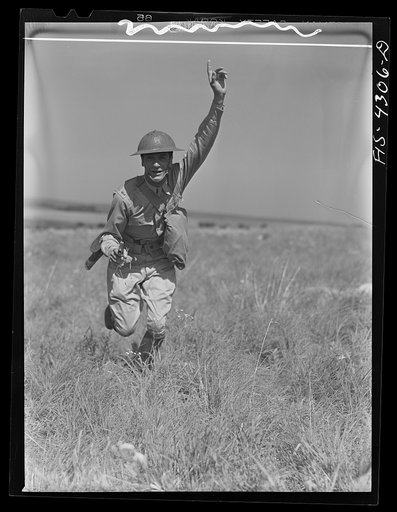 Fort Riley, Kansas. A lieutenant leading an attack during a sham battle