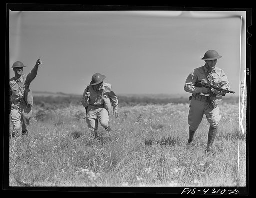 Untitled photo, possibly related to: Fort Riley, Kansas. A reconnaissance unit attacking a hill during a sham battle
