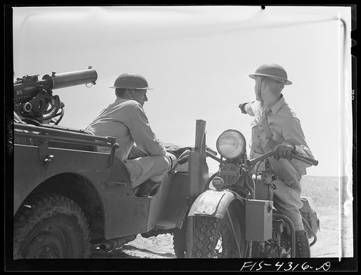 Untitled photo, possibly related to: Fort Riley, Kansas. Giving orders during a sham battle