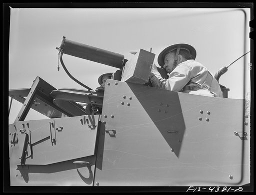 Fort Riley, Kansas. Machine gunner of a scout car of a mechanized cavalry reconnaissance unit during a sham battle