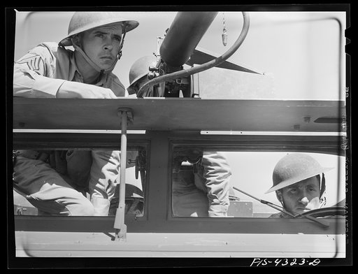 Untitled photo, possibly related to: Fort Riley, Kansas. Sergeant commanding a scout car of a mechanized cavalry reconnaissance unit