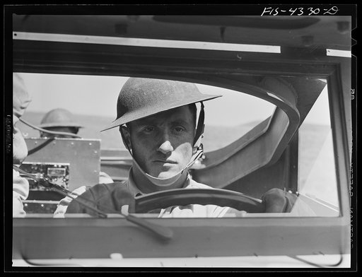 Untitled photo, possibly related to: Fort Riley, Kansas. Driver of a scout car of a mechanized cavalry reconnaissance unit