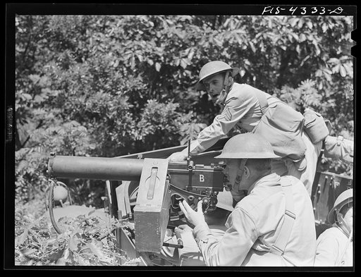 Untitled photo, possibly related to: Fort Riley, Kansas. The order to "open fire" during a sham battle involving a mechanized cavalry reconnaissance unit