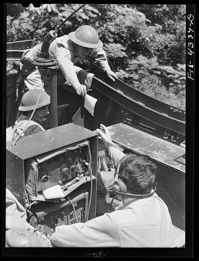 Fort Riley, Kansas. Sending a radio message from a scout car during a sham battle