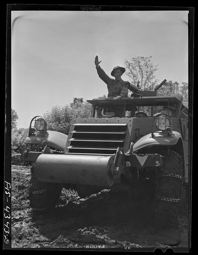 Fort Riley, Kansas. Signaling "halt" during a sham battle of a reconnaissance unit