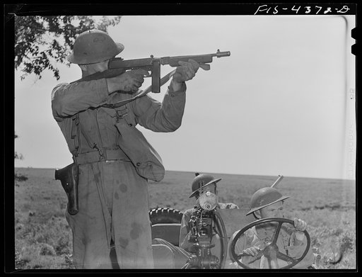 Untitled photo, possibly related to: Fort Riley, Kansas. A unit of a reconnaissance troop in action during a sham battle