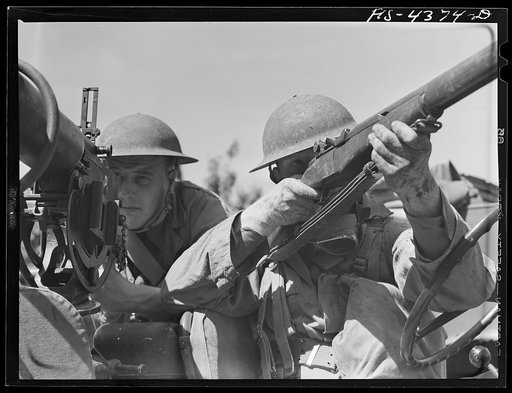 Untitled photo, possibly related to: Fort Riley, Kansas. Machine gun crew of jeep