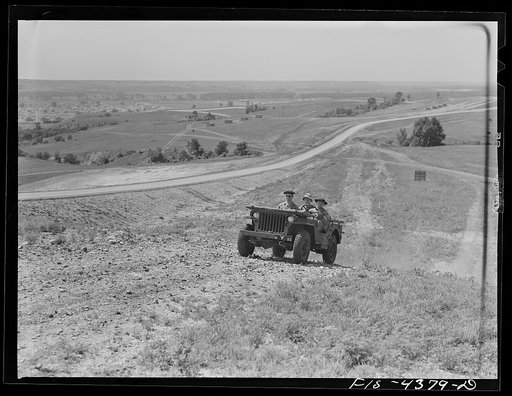 Untitled photo, possibly related to: Fort Riley, Kansas. Jeeps of a mechanized cavalry reconnaissance unit going out on a field problem