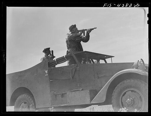 Fort Riley, Kansas. Scout car in a smokescreen during a sham battle
