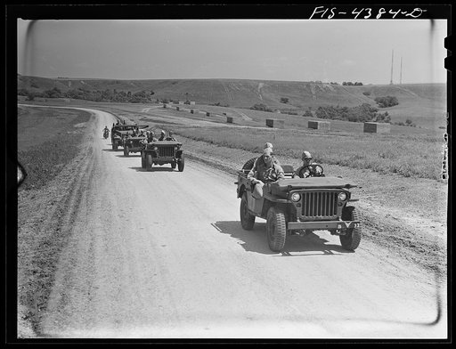 Untitled photo, possibly related to: Fort Riley, Kansas. Units of a reconnaissance platoon going back to camp after a day in the field