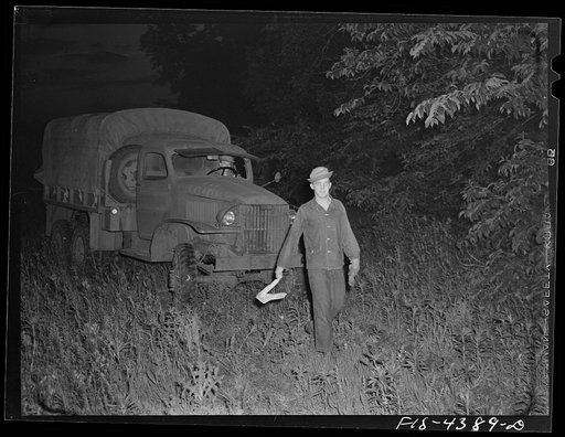 Fort Riley, Kansas. Guiding a truck into bivouac area during a blackout