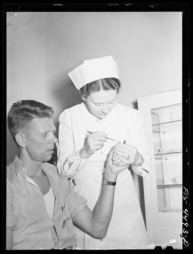Sheffield, Alabama (Tennessee Valley Authority (TVA)). Hall receives first aid at aluminum plant where he works