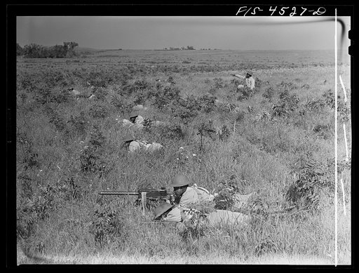 Fort Riley, Kansas. A machine gun unit in action during a sham battle
