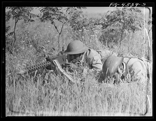 Fort Riley, Kansas. A machine gun unit in action during a sham battle