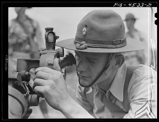 Fort Riley, Kansas. Sighting a howitzer 75 mm gun during artillery practice