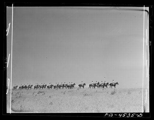 Fort Riley, Kansas. A cavalry troop heading back to camp after a day in the field on a problem
