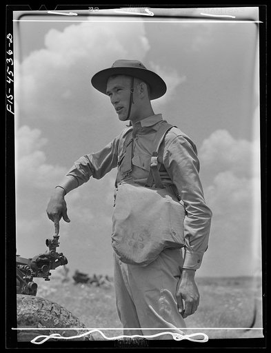 Fort Riley, Kansas. Sighting a howitzer 75 mm gun during artillery practice