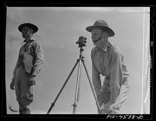 Untitled photo, possibly related to: Fort Riley, Kansas. Lining up guns for field artillery practice