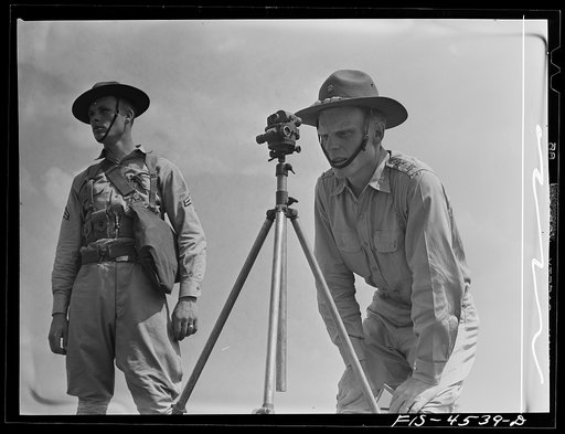 Untitled photo, possibly related to: Fort Riley, Kansas. Lining up guns for field artillery practice