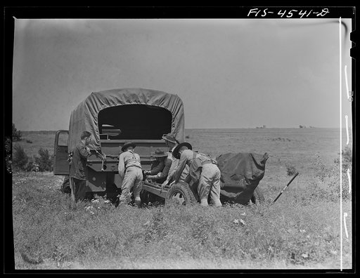 Untitled photo, possibly related to: Fort Riley, Kansas. Field artillery moving back to camp after a day of artillery practice