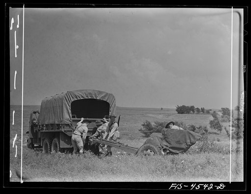 Untitled photo, possibly related to: Fort Riley, Kansas. Field artillery moving back to camp after a day of artillery practice