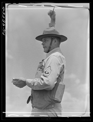 Untitled photo, possibly related to: Fort Riley, Kansas. Artillery practice. Giving the signal to fire