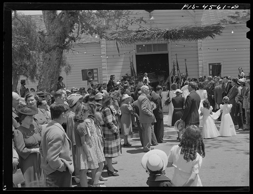 Untitled photo, possibly related to: Crowd in front of the Sociedade do Espirito Santo (SES) hall during the Holy Ghost fiesta. Santa Clara, California