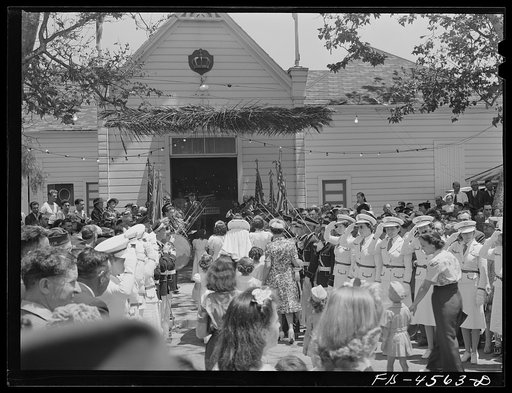 Untitled photo, possibly related to: Crowd in front of the Sociedade do Espirito Santo (SES) hall during the Holy Ghost fiesta. Santa Clara, California