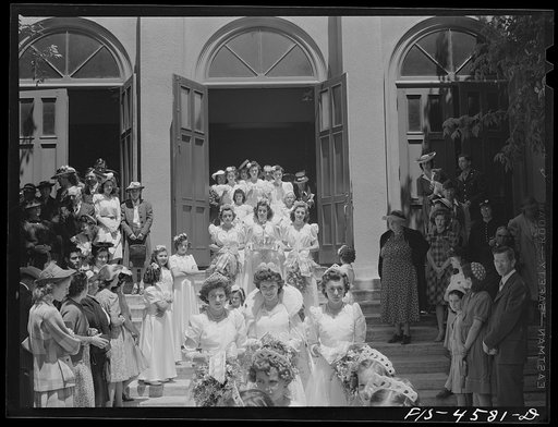 Queen and her court of the fiesta of the Holy Ghost leave church. Santa Clara, California