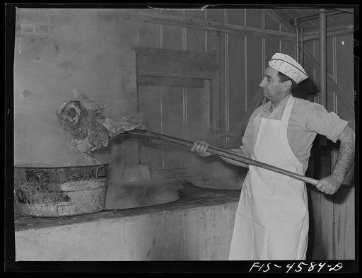 Barbecue cook prepares dinner for the fiesta of the Holy Ghost. Santa Clara, California