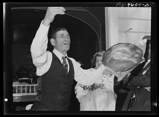 Auction followed the dinner at the fiesta of the Holy Ghost. Santa Clara, California. Rather than distributing food to the needy of the community during the fiesta of the Holy Ghost, proceeds from the auction are used for this work. It is not unusual for a single egg or lemon to sell at auction for 