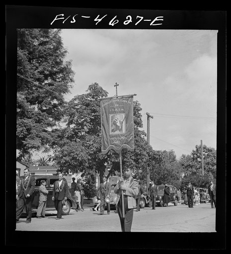 Untitled photo, possibly related to: Banners and flags in the parade of the fiesta of the Holy Ghost. Santa Clara, California