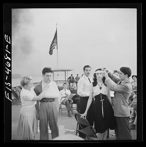 Untitled photo, possibly related to: Washington, D.C. Bandaging an "injured" arm as part of a course in first aid, aboard a Potomac River boat