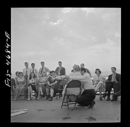 Untitled photo, possibly related to: Washington, D.C. Bandaging an "injured" arm as part of a course in first aid, aboard a Potomac River boat