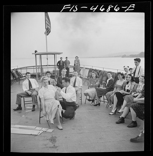 Untitled photo, possibly related to: Washington, D.C. Bandaging an "injured" arm as part of a course in first aid, aboard a Potomac River boat