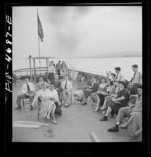Washington, D.C. Bandaging an "injured" arm as part of a course in first aid, aboard a Potomac River boat