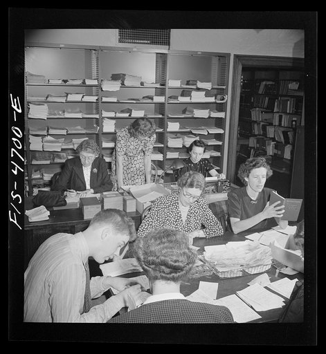 Washington, D.C. Volunteer translators in the Red Cross district library translating messages from many foreign languages: Dutch, Polish, German, French, Italian, into English so that they can be censored before going to relatives in this country The Red Cross handles messages between people in fore