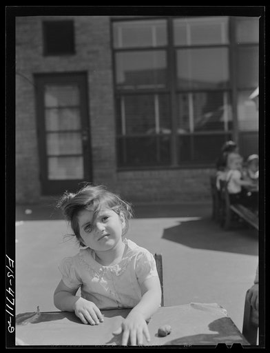 Untitled photo, possibly related to: Queens, New York. Child playing with clay at the nursery school at the Queensbridge housing project