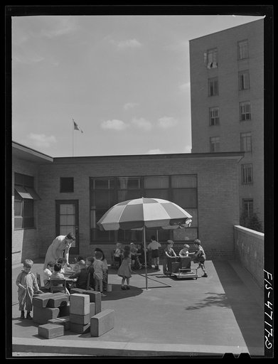 Queens, New York. Nursery school at the Queensbridge housing project. Outdoor playground