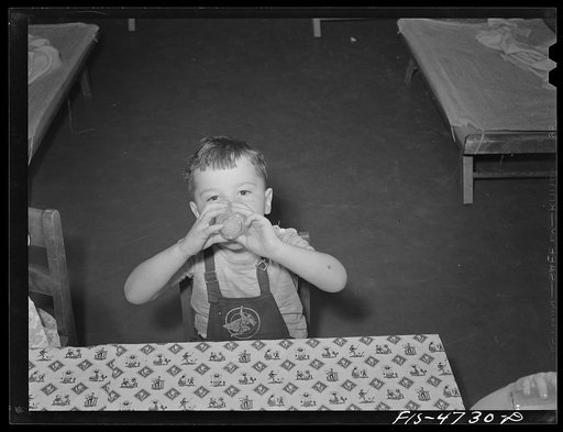 Queens, New York. Nursery school at the Queensbridge housing project. Drinking milk