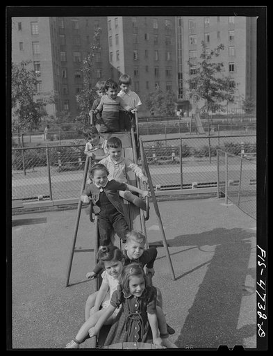 Untitled photo, possibly related to: Queens, New York. Nursery school at the Queensbridge housing project. Children on a slide