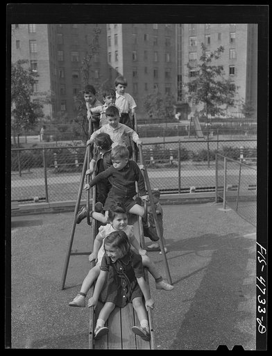 Untitled photo, possibly related to: Queens, New York. Nursery school at the Queensbridge housing project. Children on a slide
