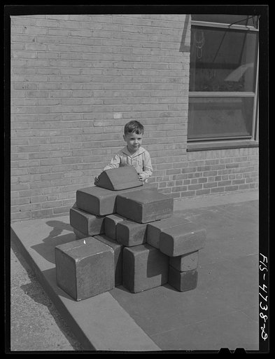 Queens, New York. Playing with blocks at the nursery school at the Queensbridge housing project