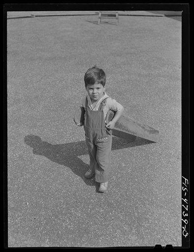 Queens, New York. Nursery school at the Queensbridge housing project. Child on the playground