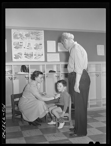 Untitled photo, possibly related to: Queens, New York. Nursery school at the Queensbridge housing project. Children are examined each morning when they are admitted to the nursery school